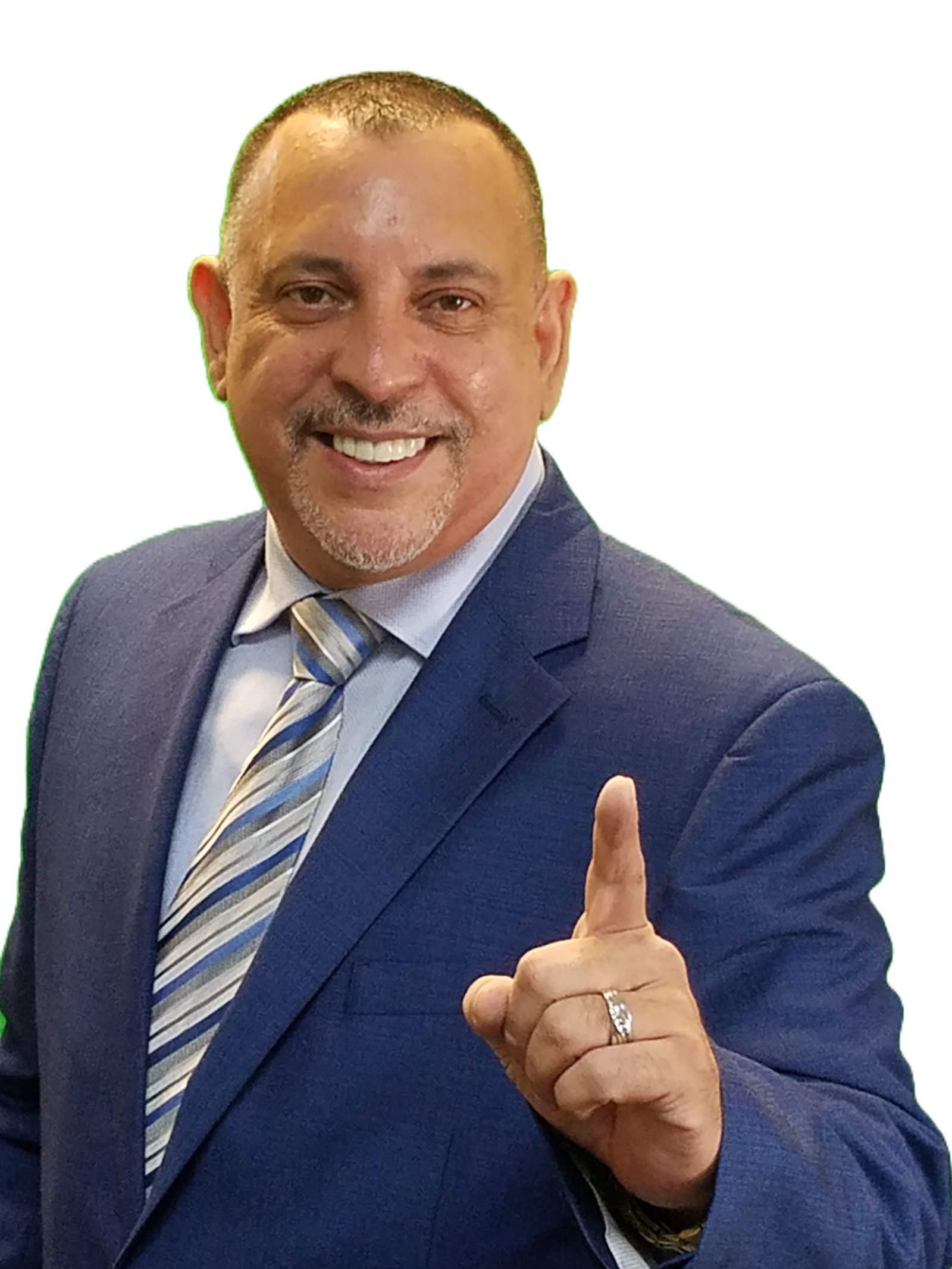 Freddy Soto smiling in a blue suit